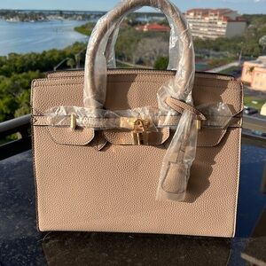 Brand new with tags, taupe purse with 2 different strap lengths.